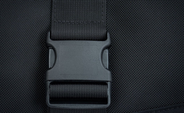 Close shot of the front flip-top compartment's buckle